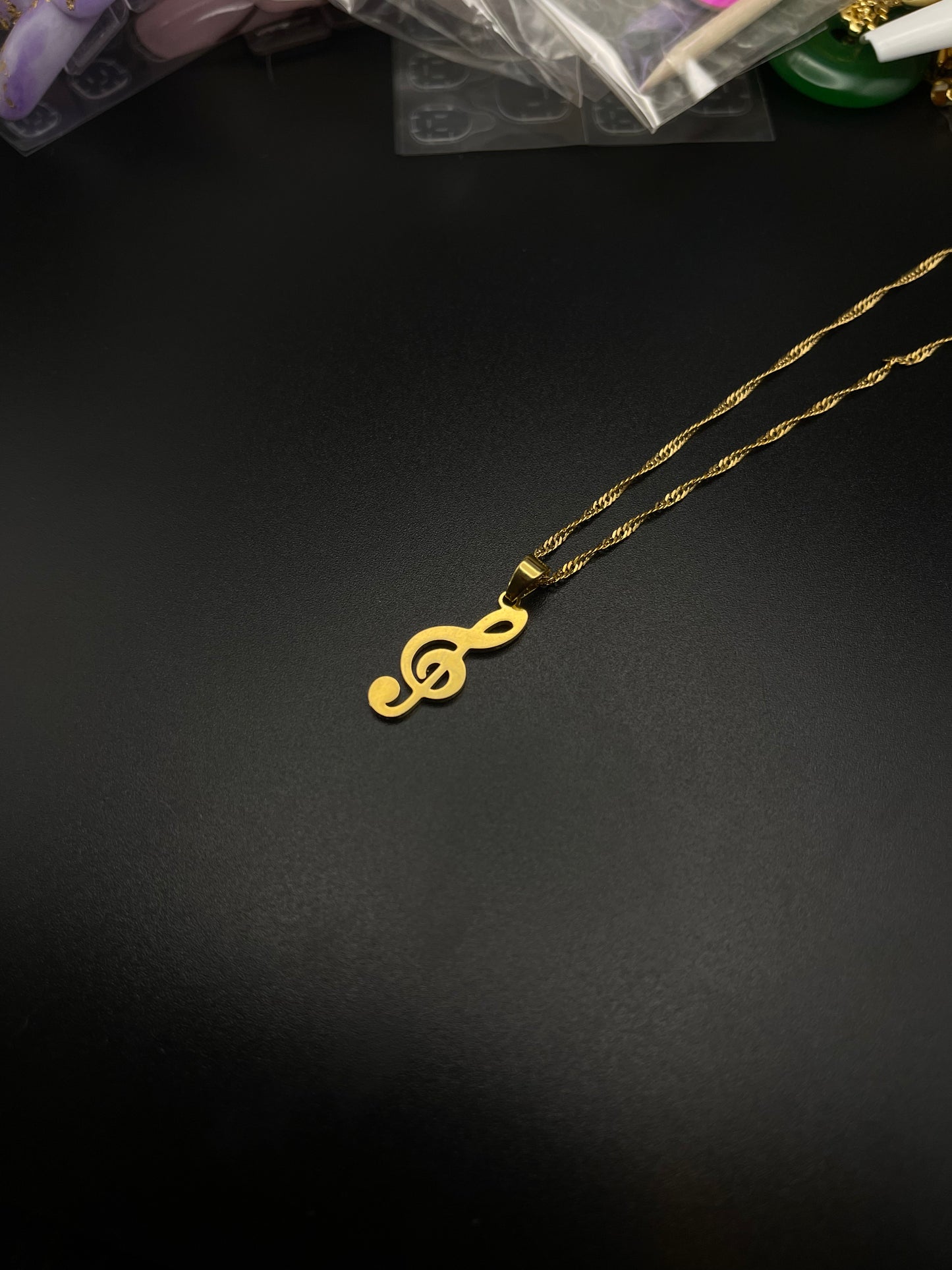 Treble clef necklace